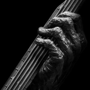 The Grip of the Old Tune fine art print — bronze musician hands on instrument strings black and white Dublin